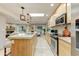 Modern kitchen with stainless steel appliances, granite countertops, and island seating at 7725 N Via De Fonda --, Scottsdale, AZ 85258