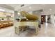Open-concept living area showcasing a grand piano, staircase, and kitchen at 7725 N Via De Fonda --, Scottsdale, AZ 85258