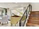 Staircase and vintage piano in an open layout, naturally lit living area at 7725 N Via De Fonda --, Scottsdale, AZ 85258