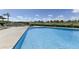 Inviting community pool with lounge chairs overlooking the golf course and lush landscaping at 7725 N Via De Fonda --, Scottsdale, AZ 85258