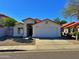 Charming single story home featuring a red tile roof and a two car garage at 7825 W Mcrae Way, Glendale, AZ 85308