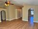 Open living space showcasing laminate floors, multiple windows and a sliding glass door at 7825 W Mcrae Way, Glendale, AZ 85308