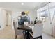 Bright dining area featuring a round table, modern chairs, and a large window at 786 W Palo Verde W Dr, Casa Grande, AZ 85122