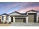 Charming single-story home featuring a three-car garage, neutral color palette and desert landscaping at 786 W Palo Verde W Dr, Casa Grande, AZ 85122