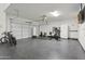 Spacious three car garage featuring an epoxy floor and well lit work out area at 786 W Palo Verde W Dr, Casa Grande, AZ 85122