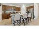 Kitchen boasts an island with bar seating, stainless appliances, and stylish cabinetry at 786 W Palo Verde W Dr, Casa Grande, AZ 85122
