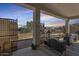 Relaxing covered patio with stylish furniture and decorative plants at 786 W Palo Verde W Dr, Casa Grande, AZ 85122