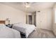 A bedroom that features two beds, a ceiling fan, and neutral carpet at 8155 E Roosevelt St # 204, Scottsdale, AZ 85257