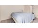 A neutral bedroom with plush carpet and access to an en-suite bathroom at 8155 E Roosevelt St # 204, Scottsdale, AZ 85257