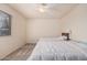 Bedroom with two beds, neutral walls and carpet, and a ceiling fan at 8155 E Roosevelt St # 204, Scottsdale, AZ 85257
