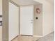 A bright entryway featuring tile flooring and a closet with a white front door at 8155 E Roosevelt St # 204, Scottsdale, AZ 85257