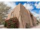 Apartment building with mature landscaping, steps to second floor unit, and desert rock at 8155 E Roosevelt St # 204, Scottsdale, AZ 85257