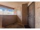 A front door with a security gate and a small outdoor entry area at 8155 E Roosevelt St # 204, Scottsdale, AZ 85257