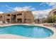 Beautiful community pool and hot tub with ample seating for residents to enjoy at 8155 E Roosevelt St # 204, Scottsdale, AZ 85257