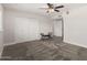 Bedroom with ample closet space, ceiling fan, neutral walls and carpet at 8238 E San Miguel Ave, Scottsdale, AZ 85250