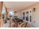 Outdoor dining on a covered patio featuring wood furniture and stylish decor at 8238 E San Miguel Ave, Scottsdale, AZ 85250