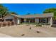 Charming single-story home with desert landscaping, a neutral color palette, and tasteful architectural details at 8238 E San Miguel Ave, Scottsdale, AZ 85250