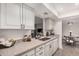 Well-lit kitchen with granite countertops, stainless steel sink, and ample storage at 8238 E San Miguel Ave, Scottsdale, AZ 85250