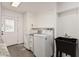 Well-organized laundry room with modern appliances, utility sink, and ample storage space at 8238 E San Miguel Ave, Scottsdale, AZ 85250