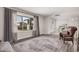 Bright living room features modern windows, neutral color scheme, and an inviting seating arrangement with a large rug at 8238 E San Miguel Ave, Scottsdale, AZ 85250