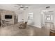 Spacious living area featuring a stone accent wall with fireplace and tile flooring at 8238 E San Miguel Ave, Scottsdale, AZ 85250