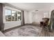 Inviting living room with hardwood floors, large window, and a comfortable armchair, perfect for relaxation at 8238 E San Miguel Ave, Scottsdale, AZ 85250