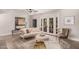 Cozy living room with plush seating, stylish decor, and natural light from the french doors at 8238 E San Miguel Ave, Scottsdale, AZ 85250