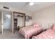 A bedroom featuring carpet, light walls, closet and two twin beds at 8438 E Stella Ln, Scottsdale, AZ 85250