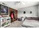 A bedroom with a white bed frame, light gray bedding, closet, and decor with a galaxy-themed poster at 8438 E Stella Ln, Scottsdale, AZ 85250