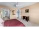 Bedroom with carpet, neutral paint, a ceiling fan and view to a hallway at 8438 E Stella Ln, Scottsdale, AZ 85250