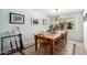 Charming dining room with a rustic wooden table, chandelier, and natural light that offers a warm, inviting place for gatherings at 8438 E Stella Ln, Scottsdale, AZ 85250