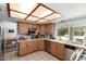 Functional kitchen with wood cabinets, ample counter space, and modern appliances, offering a great place to prepare meals at 8438 E Stella Ln, Scottsdale, AZ 85250