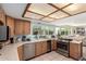 Bright kitchen featuring stainless appliances and a view of the backyard pool at 8438 E Stella Ln, Scottsdale, AZ 85250