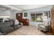 Bright living room featuring a comfortable couch, tile floors, large windows, and natural light, making it warm and inviting at 8438 E Stella Ln, Scottsdale, AZ 85250