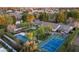 Expansive aerial view of a home with a basketball court, pool, and lush landscaping at 8602 E Gary Rd, Scottsdale, AZ 85260