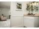 Elegant bathroom with white cabinetry, neutral countertops, and stylish decor, creating a serene space at 8602 E Gary Rd, Scottsdale, AZ 85260