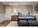 Inviting bedroom with a decorative bed, wood floors, neutral colors, and decorative pillows at 8602 E Gary Rd, Scottsdale, AZ 85260