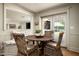 Charming breakfast nook with a built-in bench, woven chairs, and an outdoor view at 8602 E Gary Rd, Scottsdale, AZ 85260
