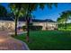 Beautiful exterior view of a well-manicured lawn and covered patio with outdoor furniture at 8602 E Gary Rd, Scottsdale, AZ 85260