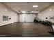 Large garage area featuring ample storage and space for recreational equipment at 8602 E Gary Rd, Scottsdale, AZ 85260