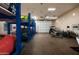 Spacious garage with high ceilings, car lifts, and parking for multiple vehicles and cycles at 8602 E Gary Rd, Scottsdale, AZ 85260