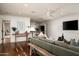 Bright living room with a view to the kitchen featuring hardwood floors and comfortable seating at 8602 E Gary Rd, Scottsdale, AZ 85260
