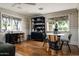 Stylish living room with natural light, wood floors, classic table, and contemporary furniture at 8602 E Gary Rd, Scottsdale, AZ 85260