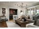 Elegant living room showcasing stylish furnishings, natural light, and open view to dining area at 8602 E Gary Rd, Scottsdale, AZ 85260