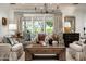 Cozy living room featuring a large window, neutral palette, patterned pillows and classic decor at 8602 E Gary Rd, Scottsdale, AZ 85260