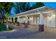 Charming outdoor patio with brick pillars, a paved walkway, and a cozy seating area for relaxation at 8602 E Gary Rd, Scottsdale, AZ 85260