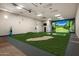 Large recreation room with a golf simulator, sand trap, and putting green for entertainment at 8602 E Gary Rd, Scottsdale, AZ 85260