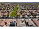 Aerial view of a neighborhood homes with well-maintained yards and mature trees, green space and park at 897 E Cherry Hills Dr, Chandler, AZ 85249