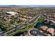 Scenic aerial view of a residential neighborhood with ponds, green spaces, and desert landscaping at 897 E Cherry Hills Dr, Chandler, AZ 85249