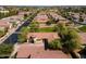 An aerial shot of the home showing mature trees and desert landscaping at 897 E Cherry Hills Dr, Chandler, AZ 85249